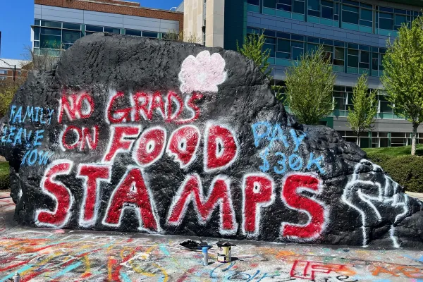 no grads on food stamps painted on the rock at utk