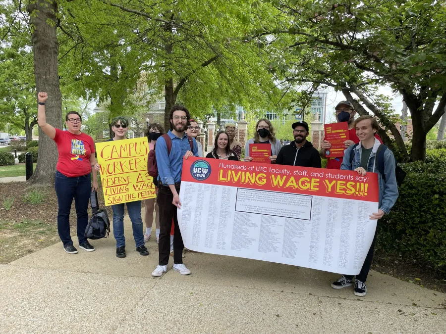 UCW members holding living wage petition